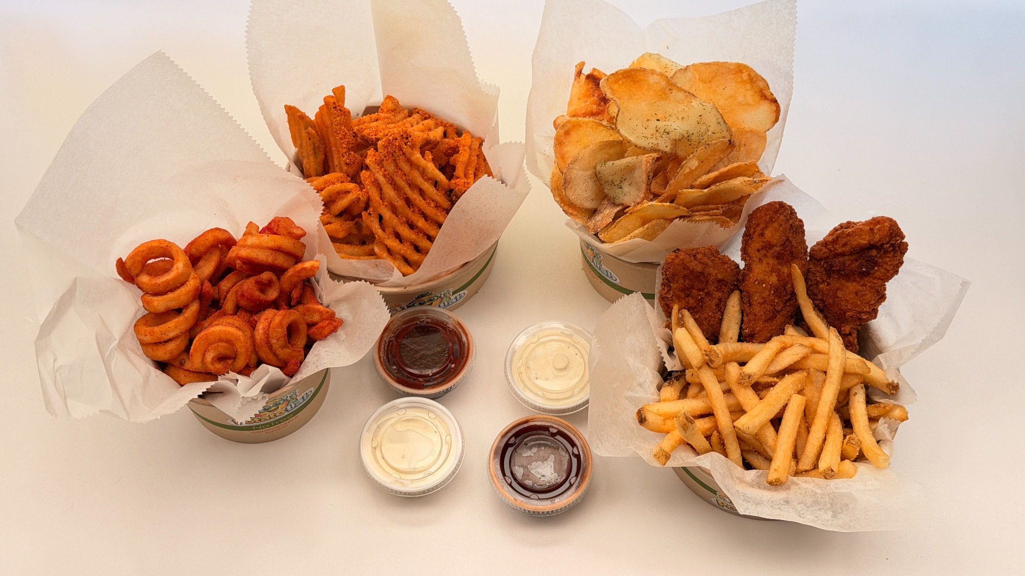 Potato Lab family pack with fries, chips, tenders and sauces