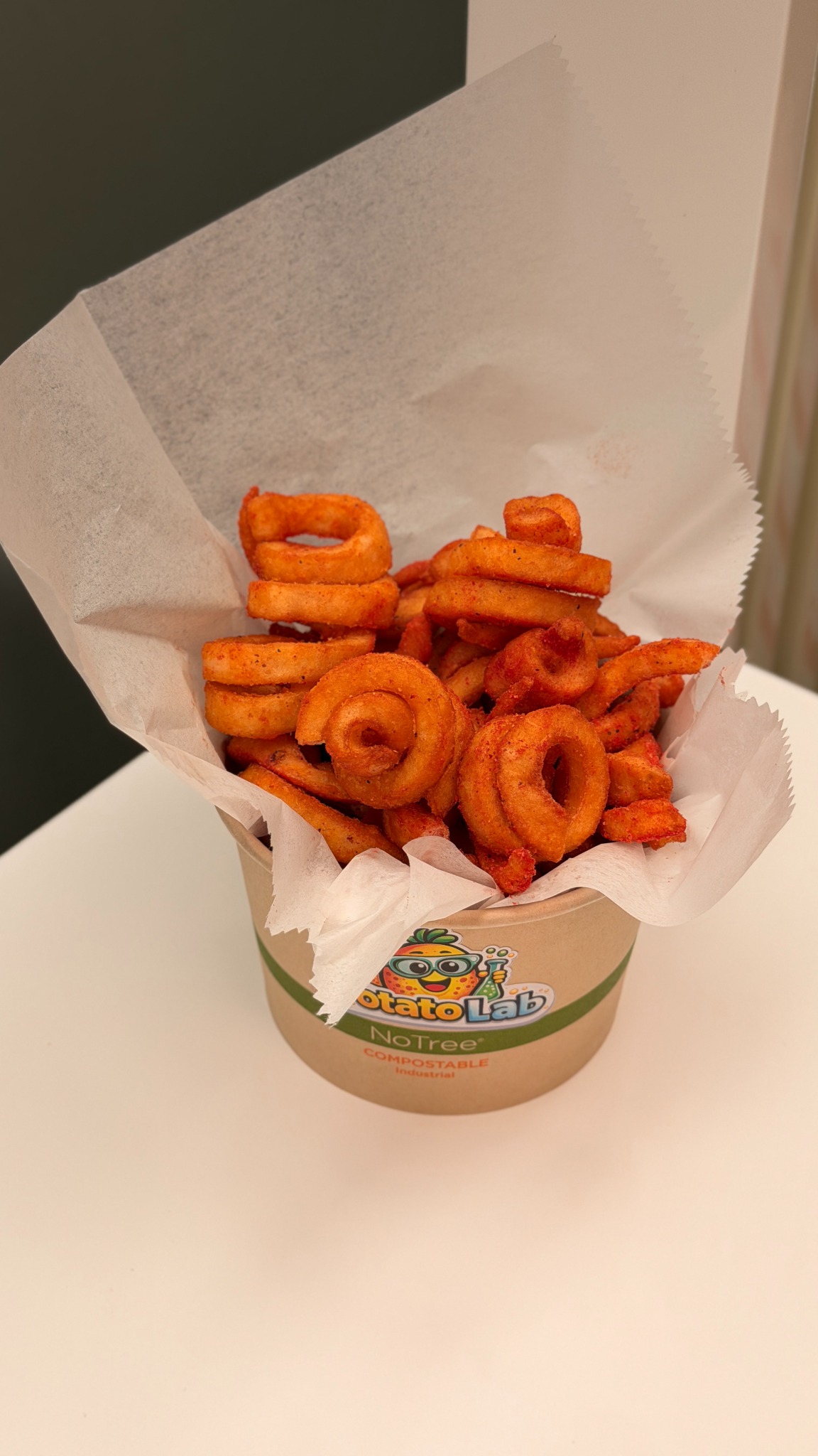 Loopy Fries with seasoning in a Potato Lab bowl